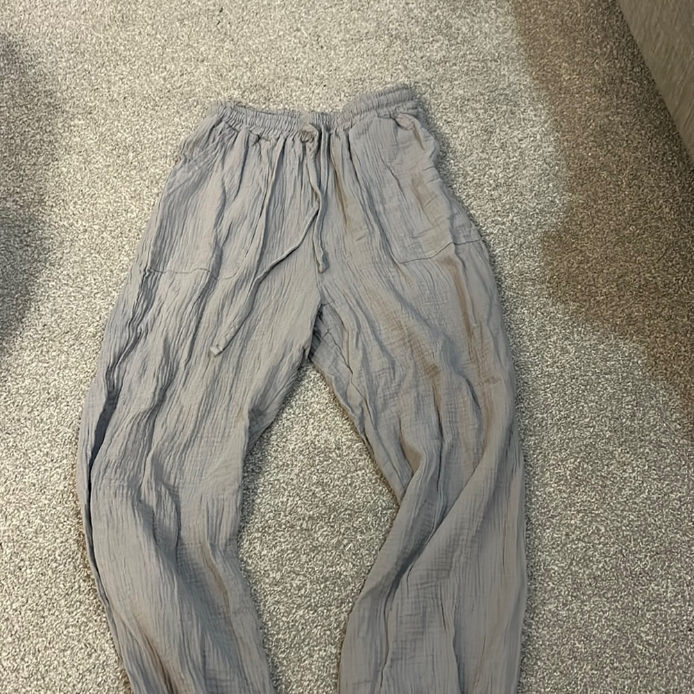 Grey joggers with cuffs at the bottom. Never worn! Small & grey.